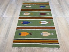 Tappeto in lana intrecciata a