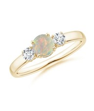 Anello a tre pietre in oro