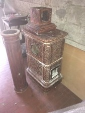 STUFA A LEGNA INIZIO ALTRO SECOLO IN TERRACOTTA SMALTATA CON CAMINO UGULAMENTE I