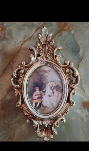 Cornice ovale barocco dorata