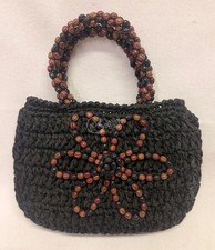 Borsa a mano nera realizzata