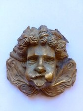 Antico ornamento in bronzo