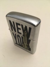 ACCENDINO TIPO ZIPPO A BENZINA ~ CHAMP ~ NEW YORK