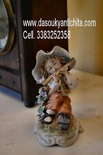 Statua in porcellana  firmata da Tiziano galli raffigurante bambino con flauto