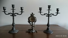 Orologio con candelabri in
