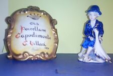 statuina "Bimbo con oca" in porcellana Capodimonte " Villari"