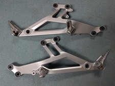 Coppia ganci poggiapiedi