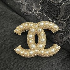 Spilla Chanel CC logo oro