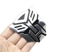 Adesivo Sticker Auto 3D Emblema Posteriore Metallizzato Transformers 7x6cm