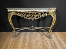 Consolle dorata con piano in