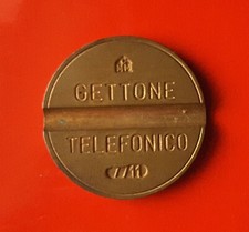 Gettone telefonico 7711 con - telefonico,