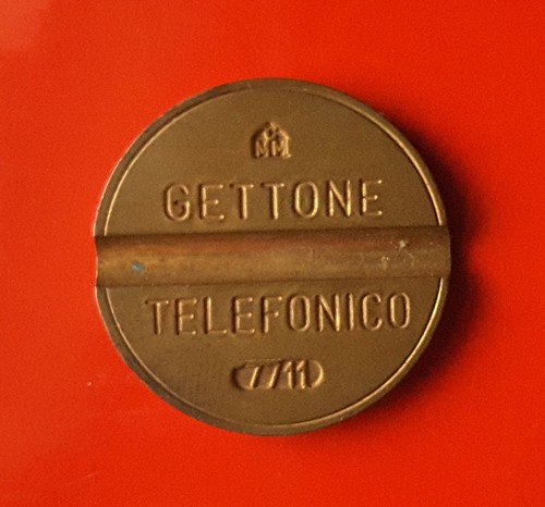 Gettone telefonico 7711 con - telefonico,