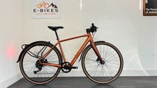 Bici ibrida Raleigh Trace rosso rame media 50 cm prezzo consigliato £ 1650 solo 30 miglia