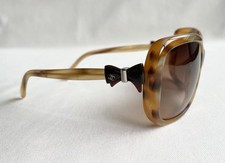 Occhiali da sole CHANEL design fiocco marrone con montatura in plastica logo CC lenti ovali