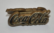 Coca Cola segna posto porta biglietti in plastica dorata