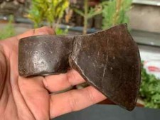 Antica testa d'ascia in ferro