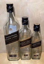 3 bottiglie vuote di whisky