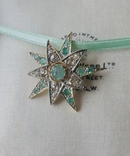 Antica spilla pendente stella