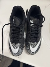 white and black nike cleats