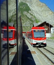 PHOTO  MGB TRAINS CROSSING AT