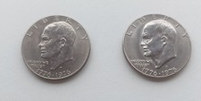 Due monete dollaro - due,