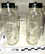 Lotto 2 biberon vintage Evenflo vetro trasparente con tappi e dischi neri retrò