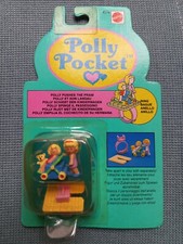 Polly pocket pushes the pram - the,