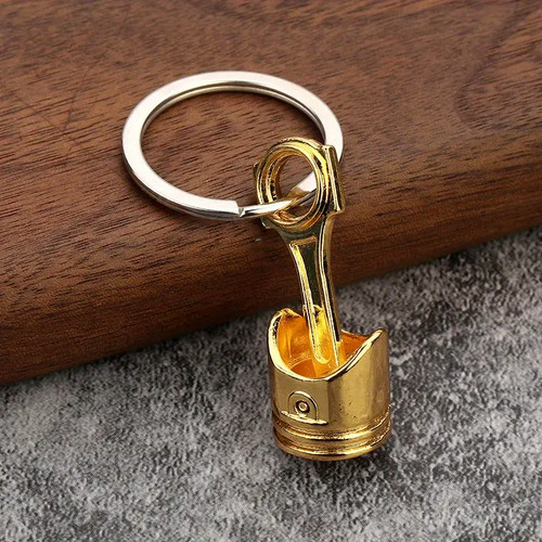 Gold piston car keychain - piston,