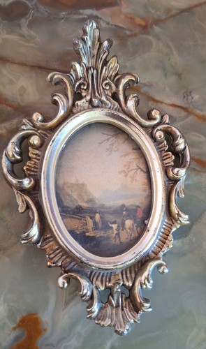 Cornice ovale barocco dorata