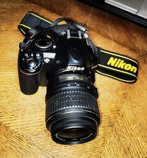 Reflex Nikon D3100 con