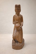 Scultura in legno intagliato-