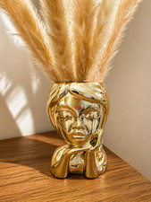 vaso in ceramica con viso oro
