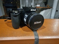 Nikon COOLPIX P100 10.3MP Digital Camera W/ Battery & 4GB SD Card” e accessori