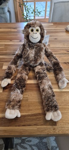 Scimmia peluche con braccia