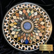 Tavolo rotondo in pietra dura