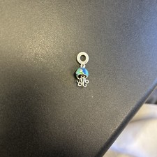 Pandora Charm, Originally