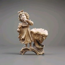 Vaso fuoriuscita figurativo
