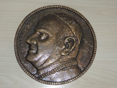 Scultura placca bronzo di - in,