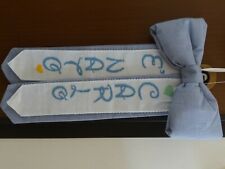 Realizzo ricami a punto croce su fiocchi nascita,completi baby,quadri....