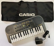 Casio SA-51 Tastiera con 32 Tasti Mini -Black/White con borsa e alimentatore