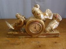 Antico orologio in terracotta