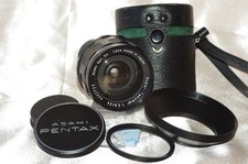 Objectif M42 24mm f3,5 SUPER TAKUMAR bouchons-étui cuir-filtre-pare-soleil TBE