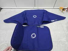 Grembiule e cappuccio blu