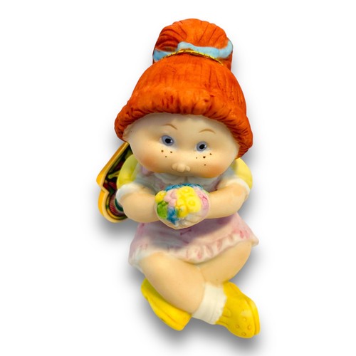 Toppa cavolo statuina bambina