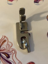 Pezzo piede orlo laminato