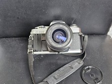 Minolta 300 con obiettivo - x,