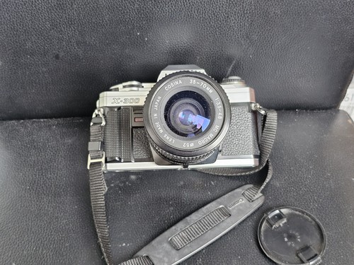Minolta 300 con - x,