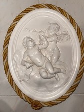 Bassorilievo ovale con putti - con, e