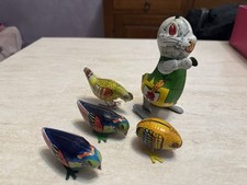 Lotto giocattoli in latta animali elicottero e pagliaccio anni 60 da collezione