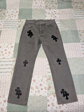 Jeans denim grigio con toppa